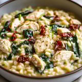 A comforting bowl of chicken and spinach rice.