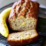 A cooling rack holding a slice of banana bread.