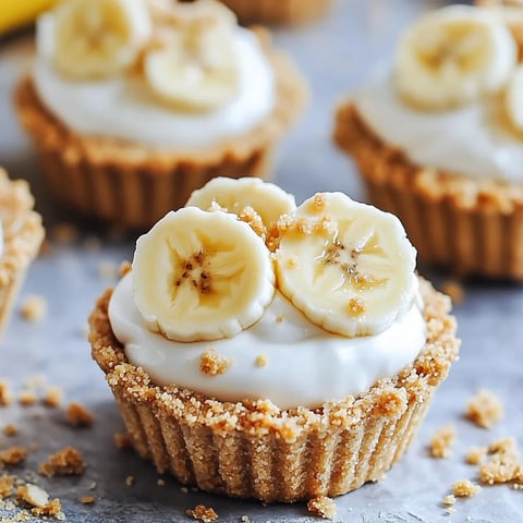 A dessert with bananas and whipped cream.